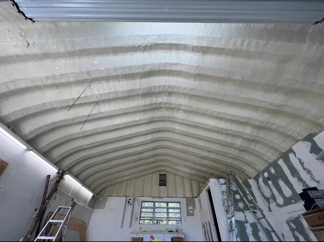 Spray polyurethane foam applied to the underside of a metal roof deck in Bull Run